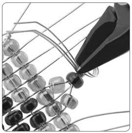 Pliers creating a loop in wire